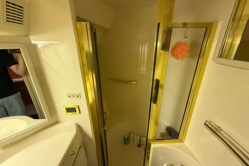 Slide: The Image of Bathroom interior of 1998 Sea Ray 500 Sundancer yacht with gold accents. - 71