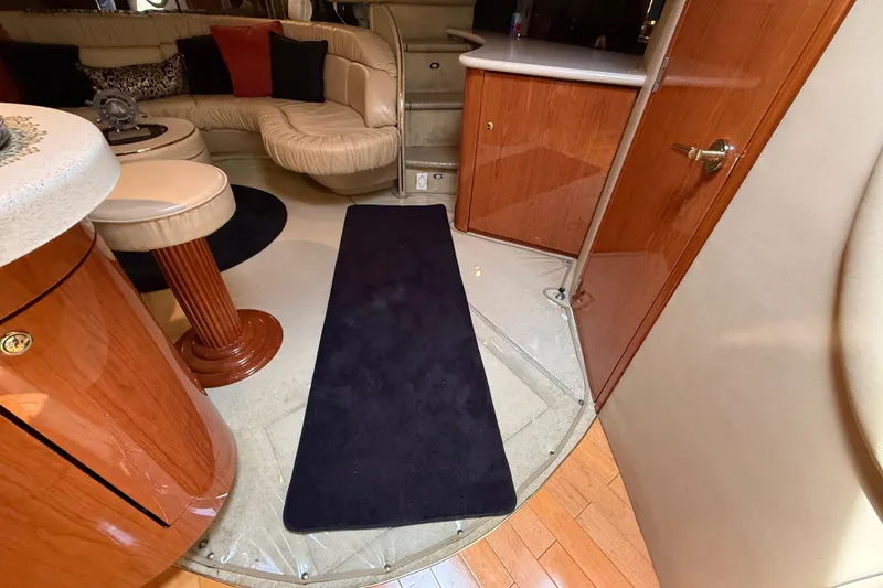 Slide: The Image of Interior of 1998 Sea Ray 500 Sundancer yacht with elegant seating and wooden cabinetry. - 73