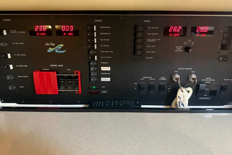 Slide: The Image of Control panel of a 1998 Sea Ray 500 Sundancer yacht, displaying electrical systems and switches. - 81