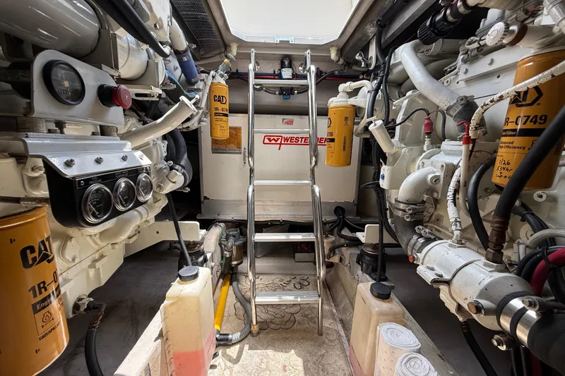 Slide: The Image of Engine room of a 1998 Sea Ray 500 Sundancer with CAT filters and machinery. - 82