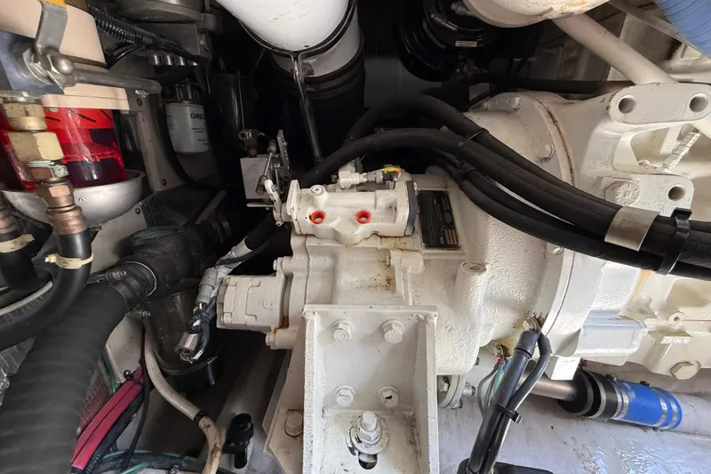 Slide: The Image of Engine compartment of a 1998 Sea Ray 500 Sundancer boat, showing mechanical components. - 87