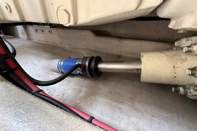 Slide: The Image of Engine compartment of a 1998 Sea Ray 500 Sundancer, featuring mechanical components and wiring. - 91