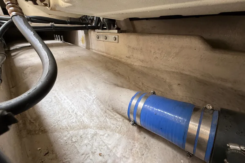 Slide: The Image of Engine compartment of 1998 Sea Ray 500 Sundancer with visible hoses and fittings. - 92