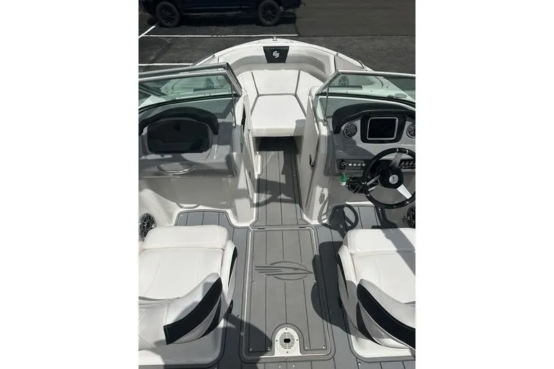 Slide: The Image of 2021 Chaparral 21 Surf boat interior with sleek seating and modern dashboard design. - 14