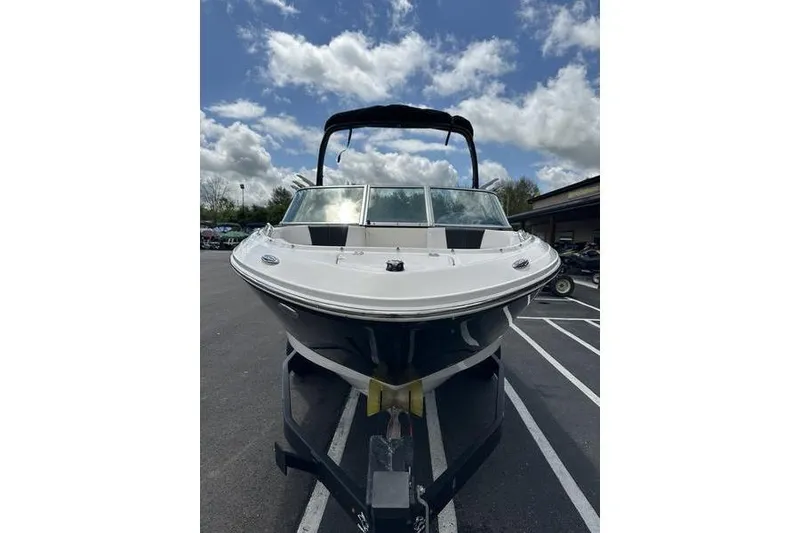 Slide: The Image of 2021 Chaparral 21 Surf boat on trailer under cloudy sky. - 4
