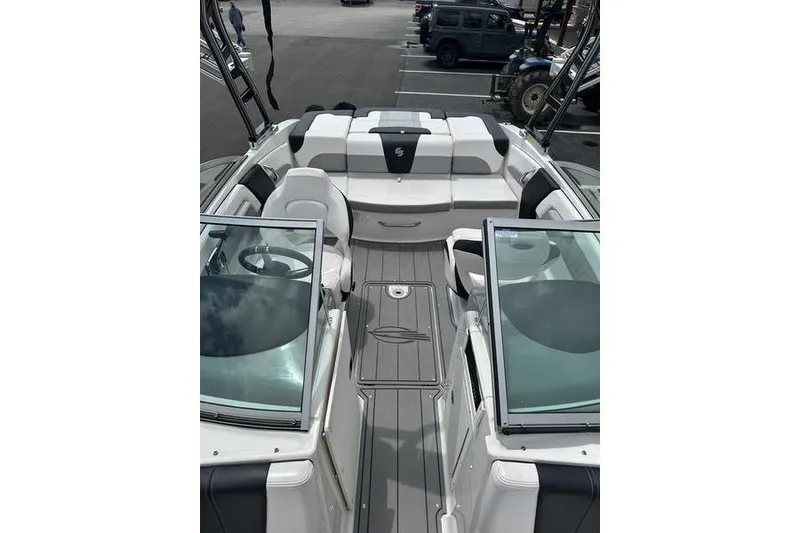 Slide: The Image of 2021 Chaparral 21 Surf boat interior with seating and steering wheel. - 6