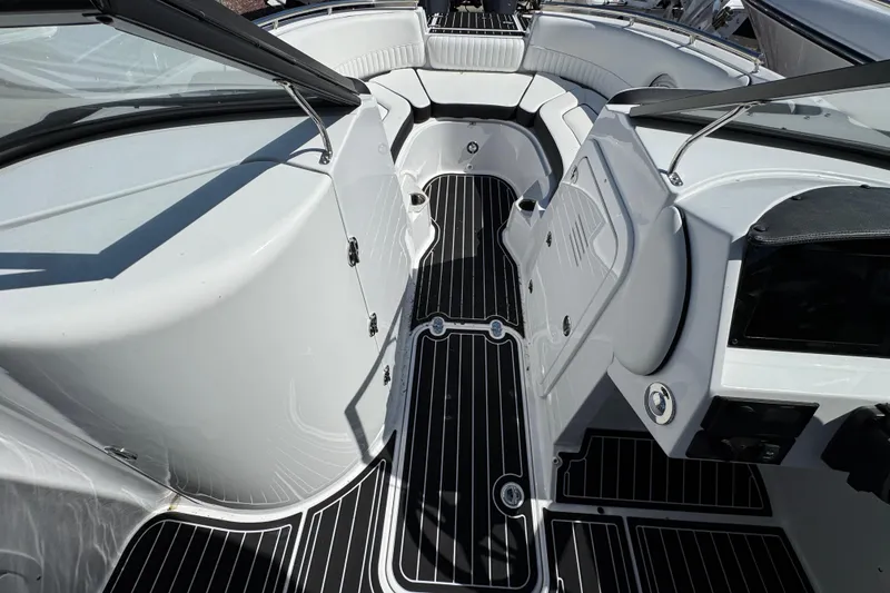 Slide: The Image of 2026 Stingray 231 DC boat interior with sleek black and white design, spacious seating. - 17