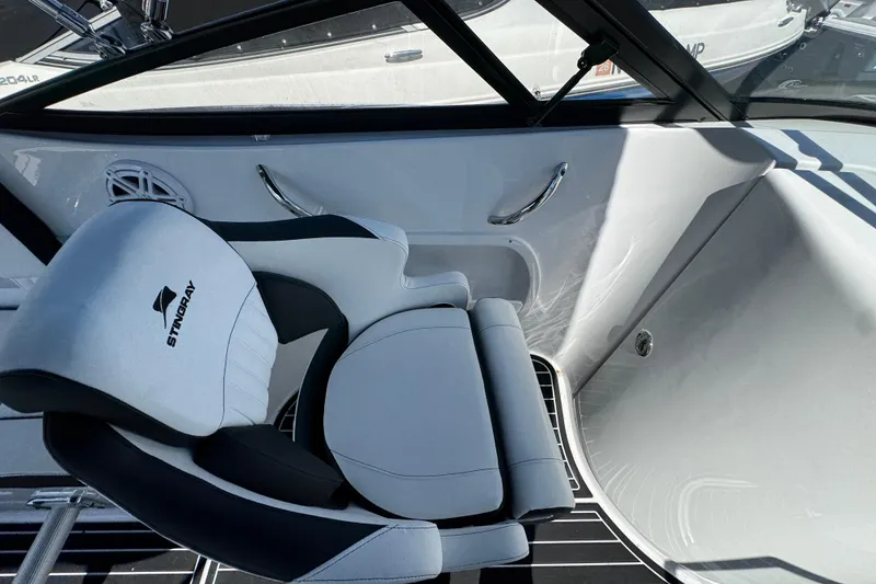 Slide: The Image of 2026 Stingray 231 DC boat interior with sleek seating and modern design. - 18