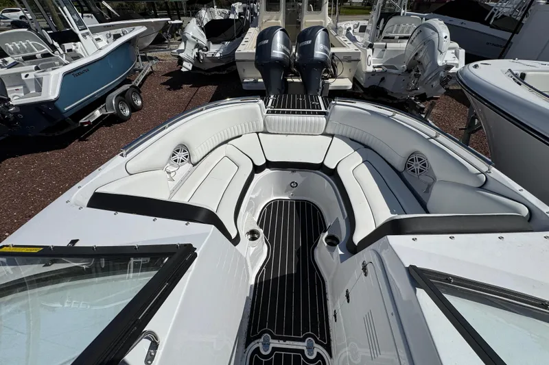 Slide: The Image of 2026 Stingray 231 DC boat interior with sleek seating and modern design. - 21