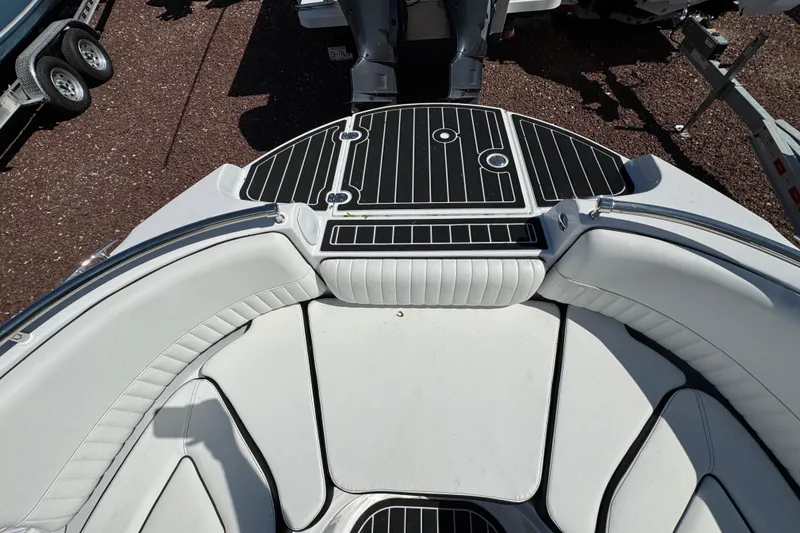 Slide: The Image of 2026 Stingray 231 DC boat interior with sleek white seating and black accents. - 25