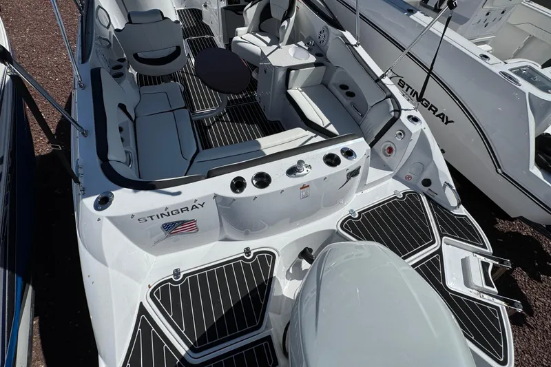 Slide: The Image of 2026 Stingray 231 DC boat interior with sleek seating and modern design features. - 3