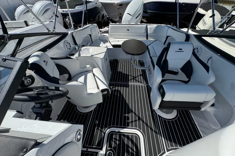 Slide: The Image of 2026 Stingray 231 DC boat interior with sleek seating and modern design. - 30