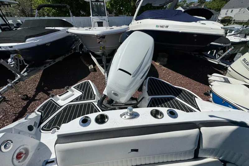 Slide: The Image of 2026 Stingray 231 DC boat with sleek design and powerful outboard motor. - 34