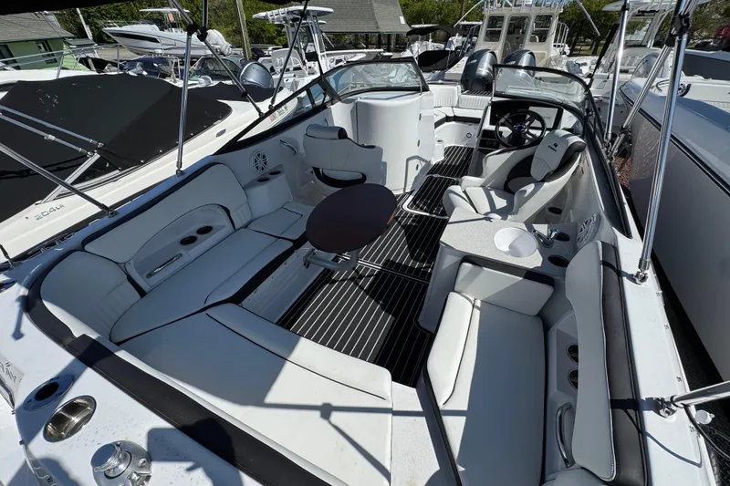 Slide: The Image of 2026 Stingray 231 DC boat interior with sleek seating and modern design features. - 5