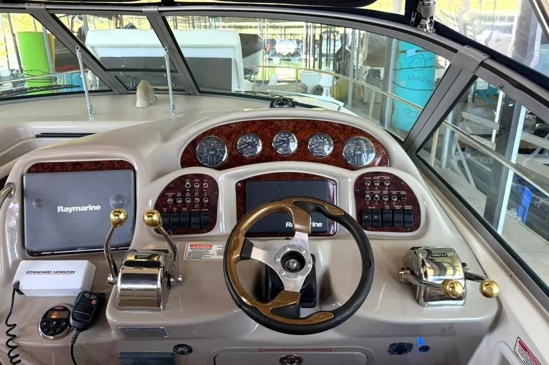 Slide: The Image of Cockpit of 2006 Sea Ray Sundancer 320 with Raymarine navigation system and control panel. - 30