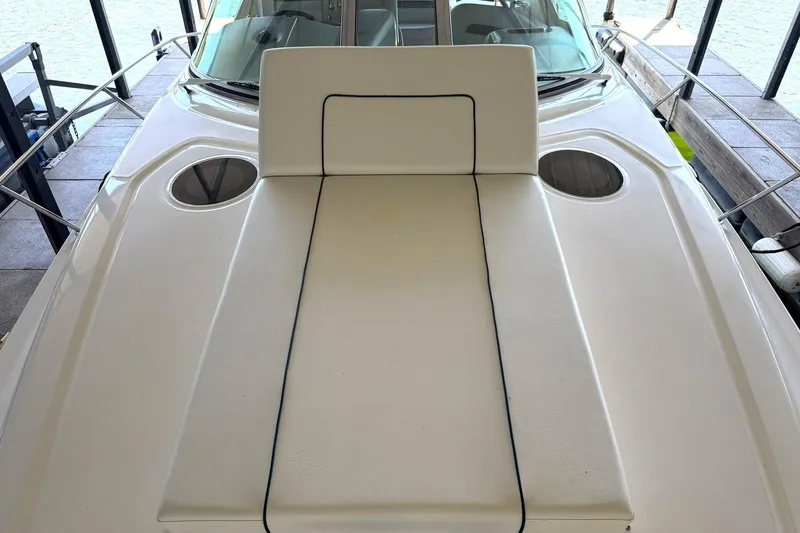 Slide: The Image of 2006 Sea Ray Sundancer 320 boat deck with cushioned seating and cup holders. - 34