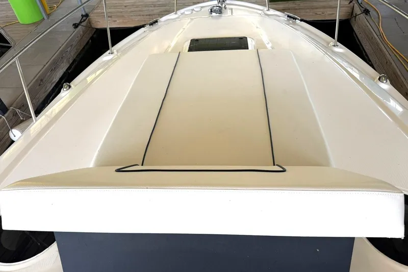 Slide: The Image of 2006 Sea Ray Sundancer 320 boat deck with sleek white design and railing. - 35