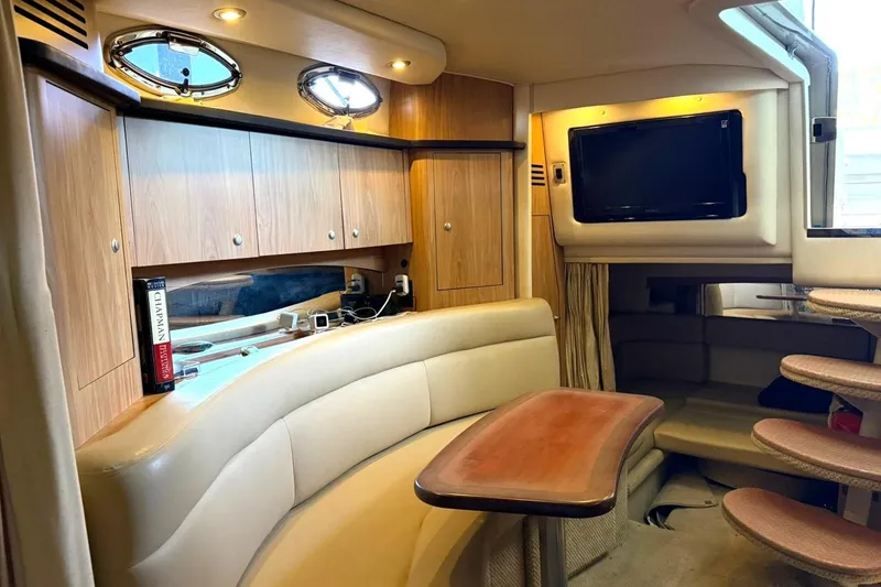 Slide: The Image of Luxurious interior of a 2006 Sea Ray Sundancer 320 yacht with wood accents and seating area. - 45