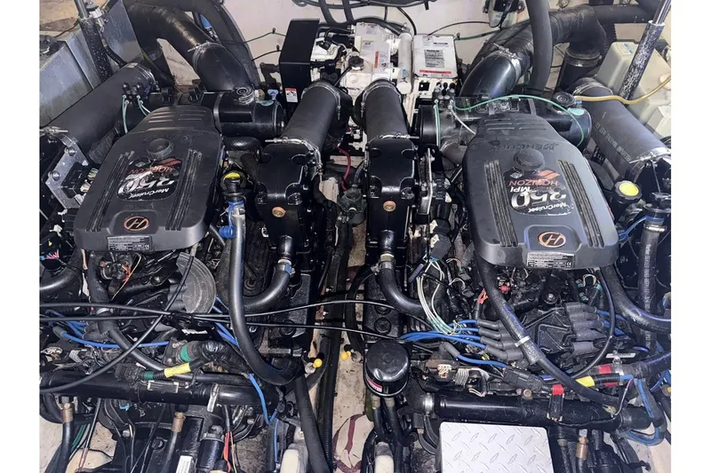 Slide: The Image of Engine compartment of a 2006 Sea Ray Sundancer 320 with twin MerCruiser engines. - 52