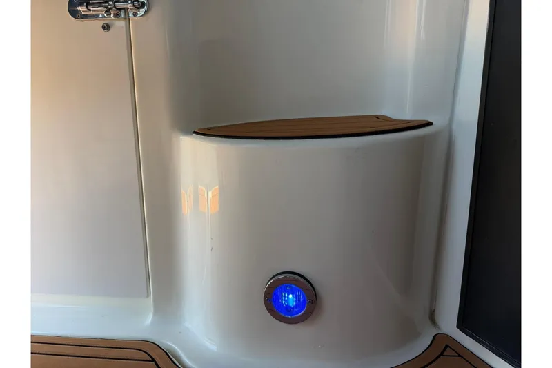 Slide: The Image of 2006 Sea Ray Sundancer 320 interior detail with blue LED light and wooden accents. - 55