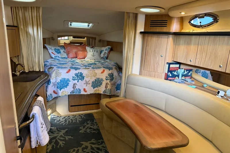 Slide: The Image of Interior of 2006 Sea Ray Sundancer 320 with cozy bed and seating area. - 6