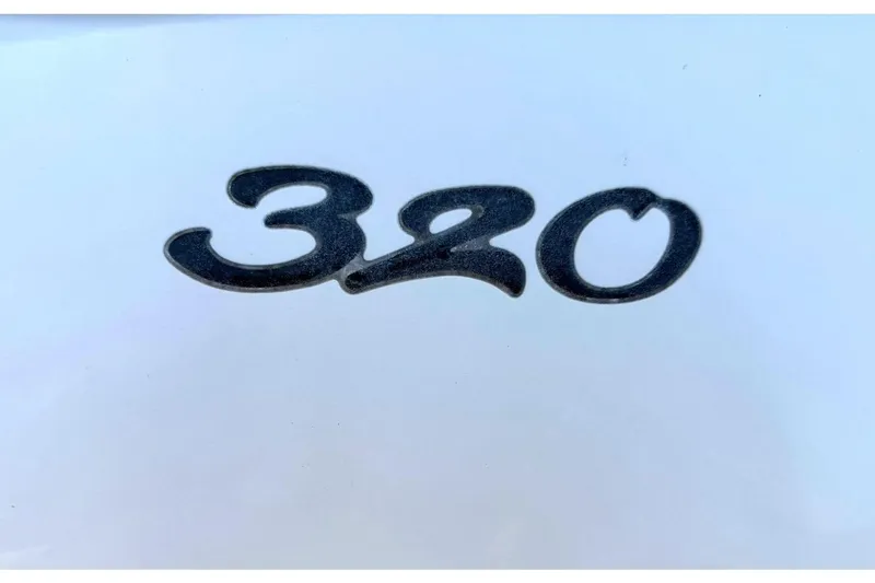 Slide: The Image of Close-up of '320' emblem on 2006 Sea Ray Sundancer 320 boat. - 62