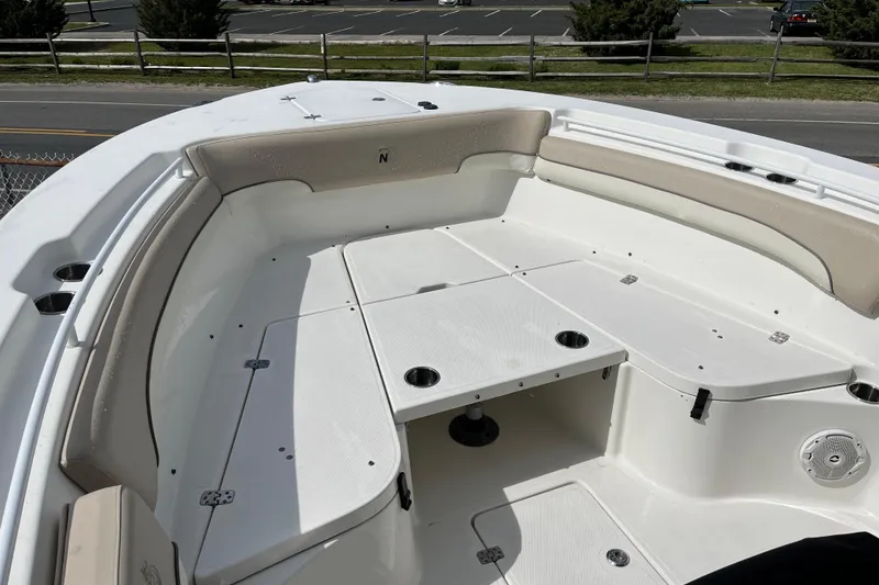 Slide: The Image of 2017 NauticStar 28 XS boat interior with spacious seating and storage compartments. - 12