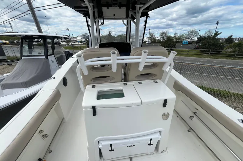 Slide: The Image of 2017 NauticStar 28 XS boat interior with rod holders and storage compartments. - 7
