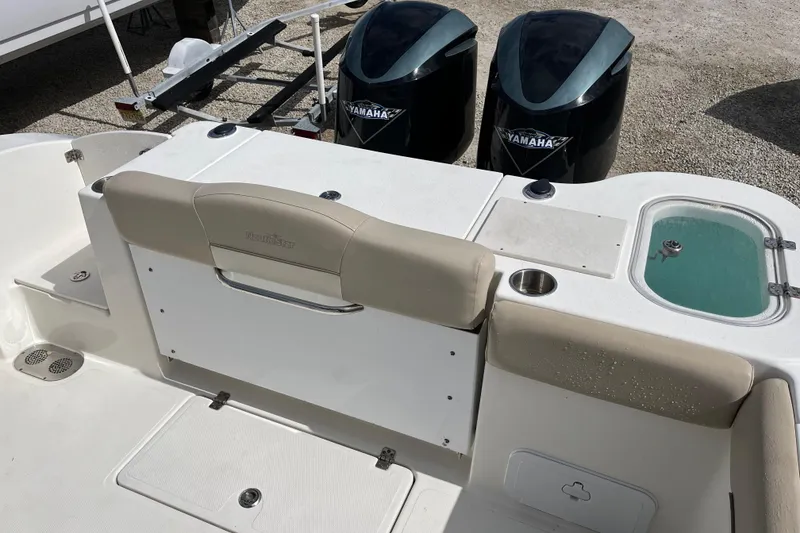 Slide: The Image of 2017 NauticStar 28 XS boat with Yamaha engines and seating area. - 9