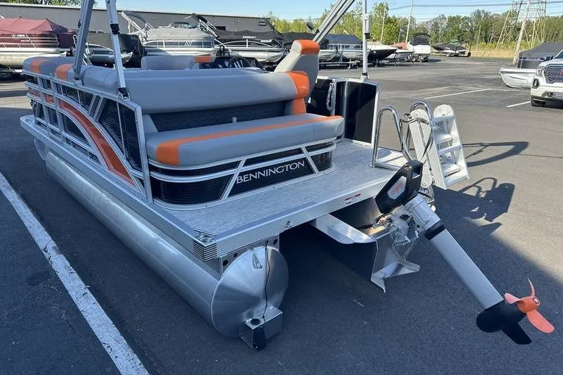 Slide: The Image of 2026 Bennington S L-Bench 168 SLJ pontoon boat with orange and gray seating. - 13