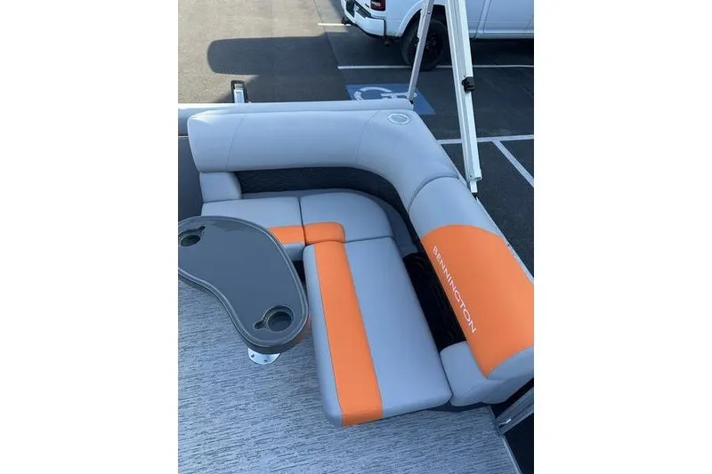 Slide: The Image of 2026 Bennington S L-Bench 168 SLJ boat seating with orange and gray upholstery. - 4