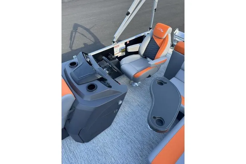 Slide: The Image of 2026 Bennington S L-Bench 168 SLJ boat interior with orange and gray seating. - 6
