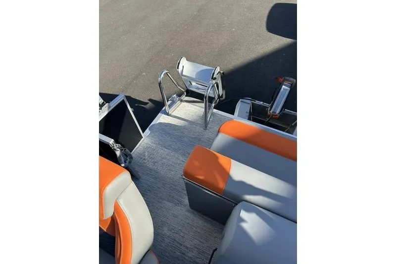 Slide: The Image of 2026 Bennington S L-Bench 168 SLJ boat interior with orange and gray seating. - 8