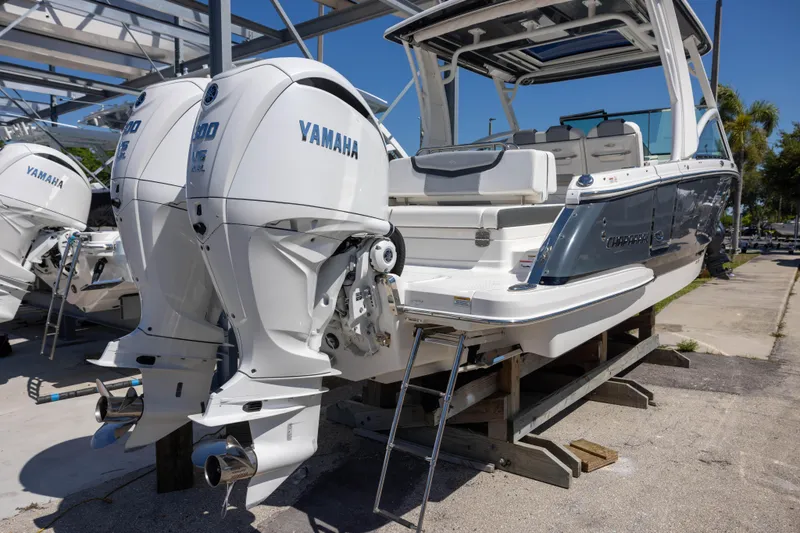 Slide: The Image of 2022 Chaparral 300 OSX boat with twin Yamaha outboard engines on display. - 3