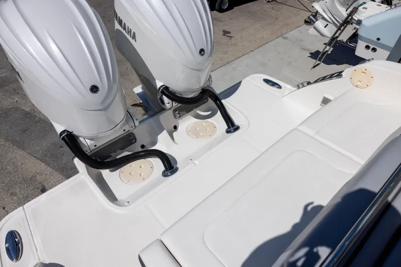 Slide: The Image of 2022 Chaparral 300 OSX boat with dual Yamaha outboard engines on deck. - 6