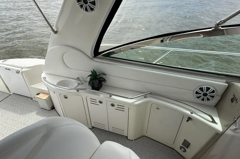 Slide: The Image of Luxurious interior of 2000 Sea Ray 410 Sundancer yacht with sleek design and water view. - 10