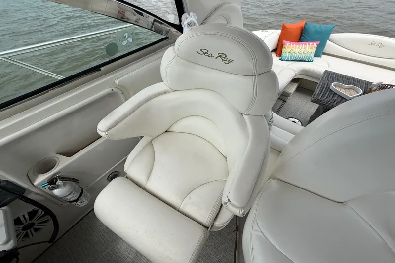 Slide: The Image of Luxurious interior of 2000 Sea Ray 410 Sundancer yacht with plush seating and scenic water view. - 15