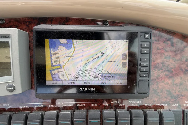 Slide: The Image of Garmin navigation system on 2000 Sea Ray 410 Sundancer boat dashboard. - 18