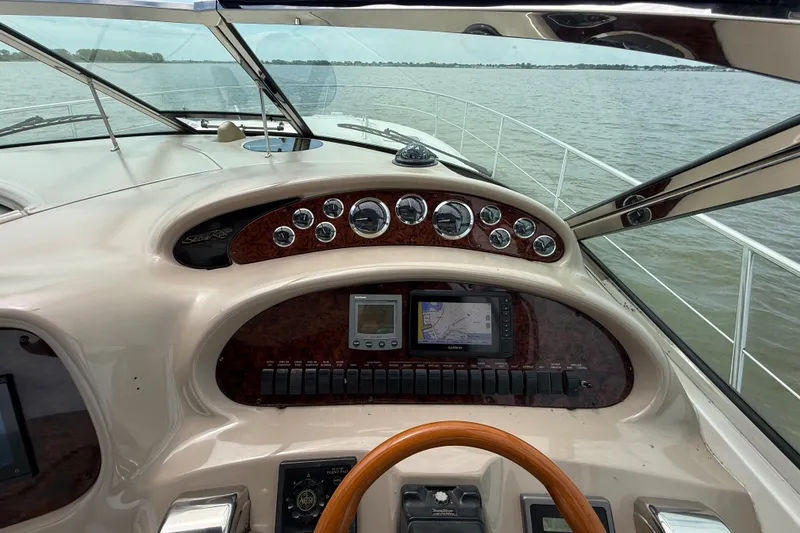 Slide: The Image of Cockpit view of 2000 Sea Ray 410 Sundancer yacht with navigation instruments. - 19