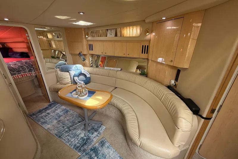 Slide: The Image of Luxurious interior of a 2000 Sea Ray 410 Sundancer yacht with plush seating and elegant decor. - 31