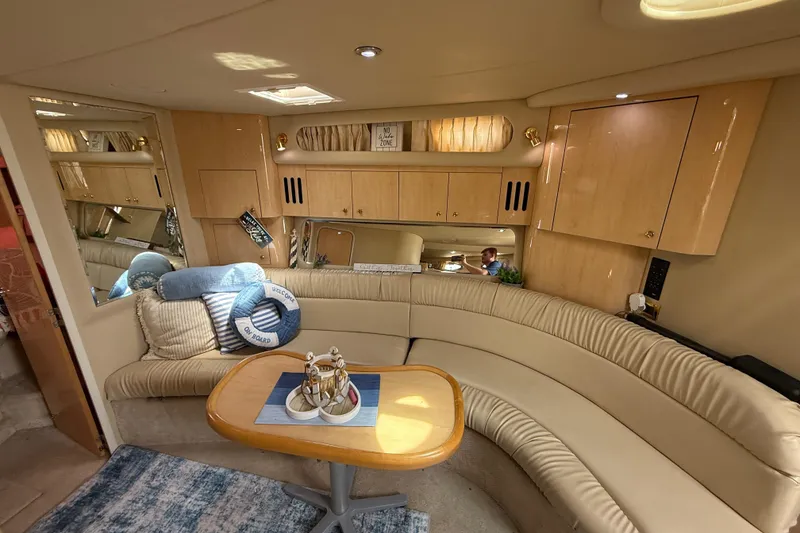 Slide: The Image of Luxurious interior of 2000 Sea Ray 410 Sundancer yacht with plush seating and elegant decor. - 32