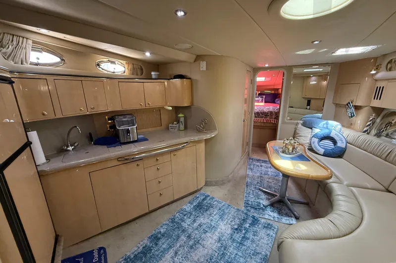 Slide: The Image of Luxurious interior of a 2000 Sea Ray 410 Sundancer yacht with modern amenities. - 36