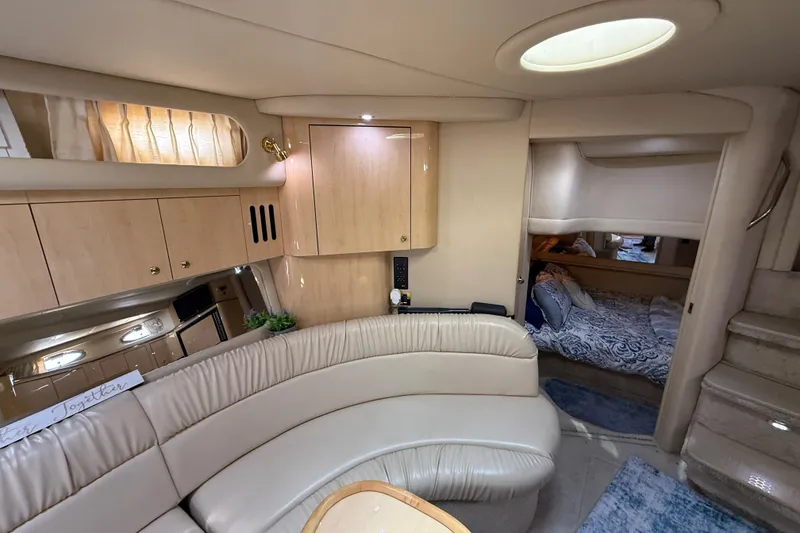 Slide: The Image of Luxurious interior of a 2000 Sea Ray 410 Sundancer yacht with plush seating and cozy cabin. - 39
