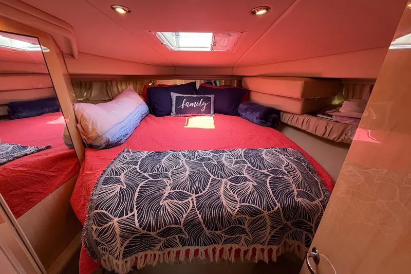 Slide: The Image of Luxurious cabin interior of 2000 Sea Ray 410 Sundancer yacht with cozy bedding. - 40