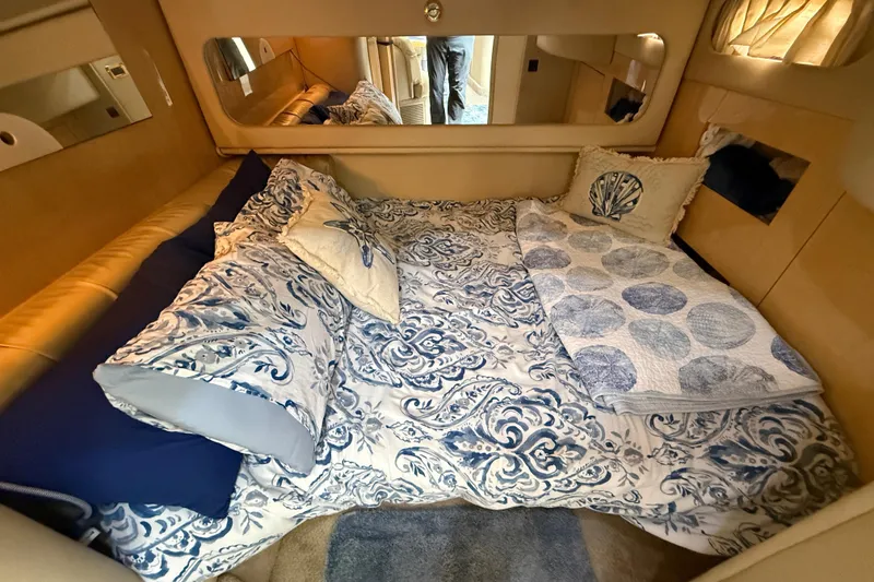 Slide: The Image of Luxurious cabin interior of 2000 Sea Ray 410 Sundancer with elegant bedding. - 47