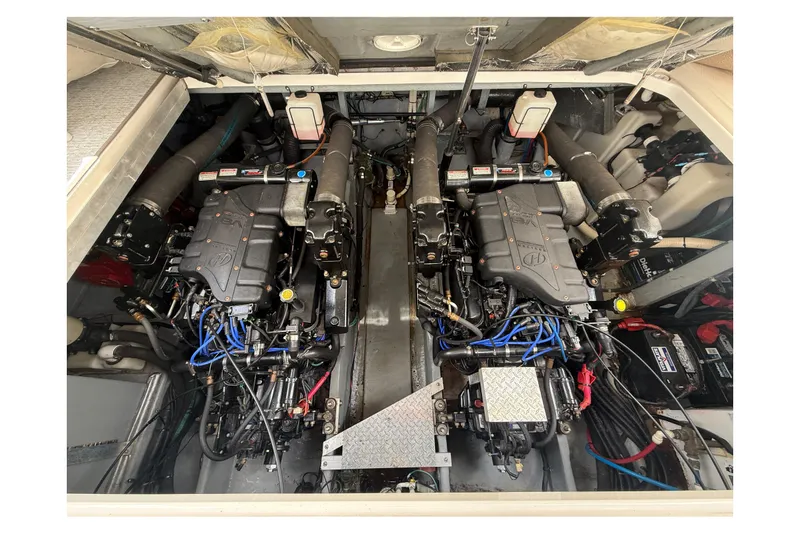 Slide: The Image of Engine compartment of a 2000 Sea Ray 410 Sundancer, showcasing dual engines and components. - 52