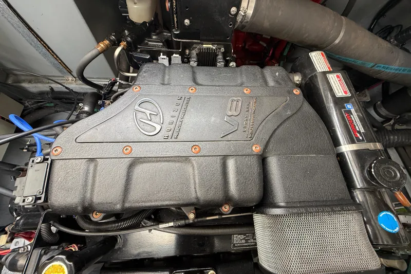 Slide: The Image of Engine compartment of a 2000 Sea Ray 410 Sundancer with a V8 Horizon engine. - 55