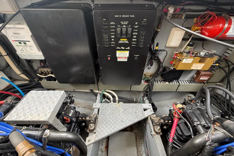 Slide: The Image of Engine room of a 2000 Sea Ray 410 Sundancer with control panel and wiring. - 58