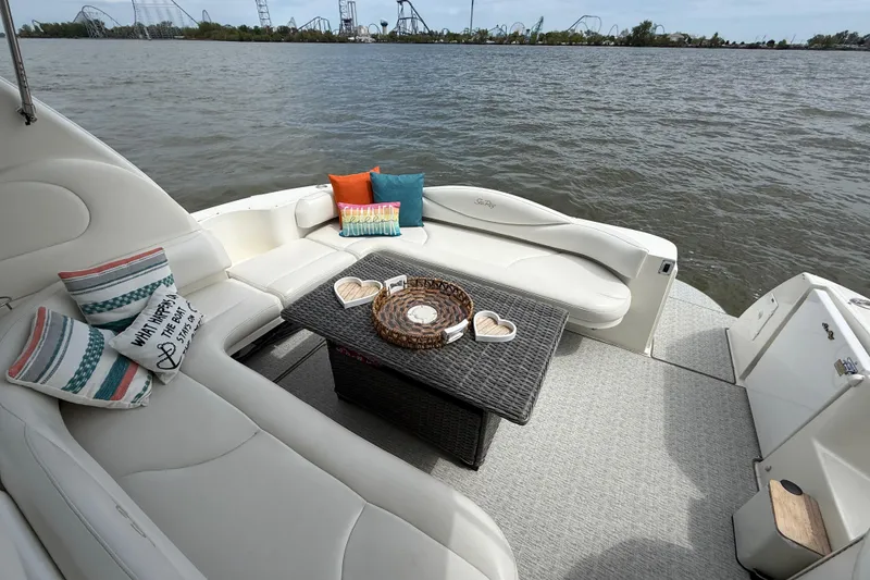 Slide: The Image of Luxurious 2000 Sea Ray 410 Sundancer yacht with cozy seating and scenic water view. - 7