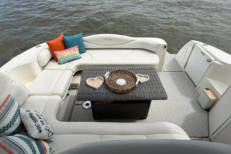 Slide: The Image of Luxurious 2000 Sea Ray 410 Sundancer boat interior with cozy seating and decorative pillows. - 9